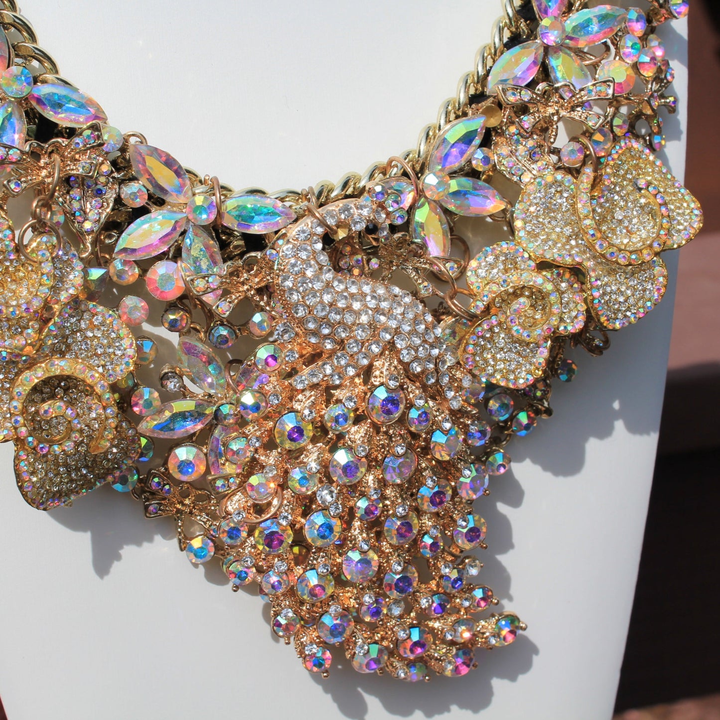 Shimmer Strut: Big Ass Sparkle Rhinestone Peacock Breastshield Statement Necklace
